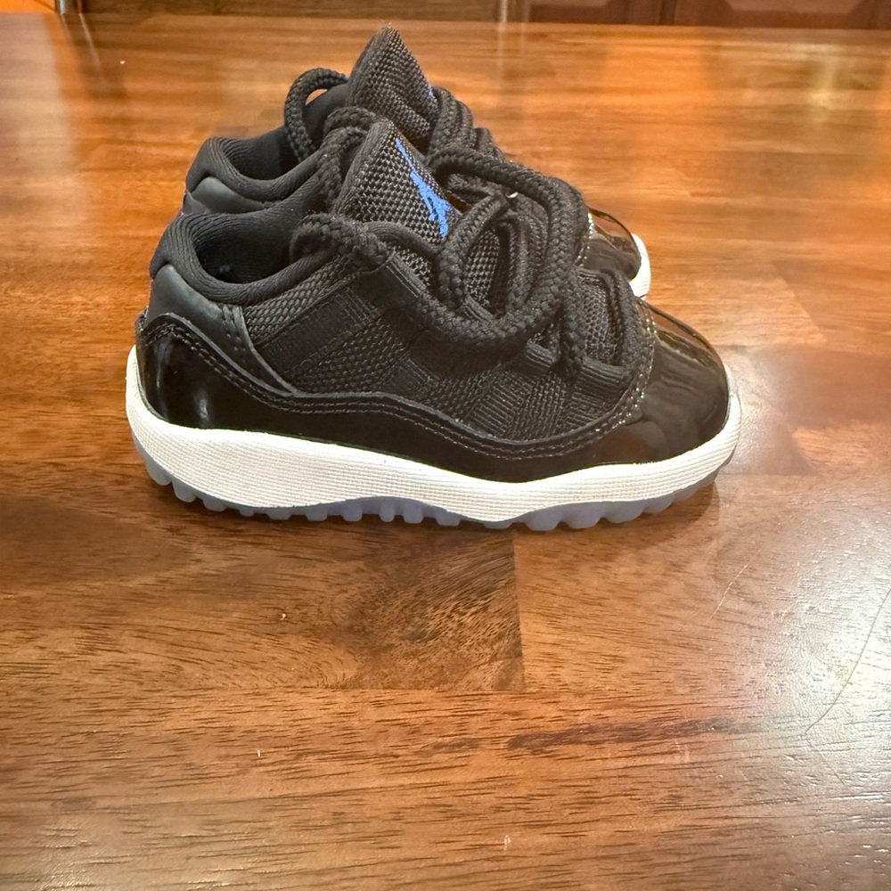 Jordan Kids Black and White Sneakers with Blue Accent